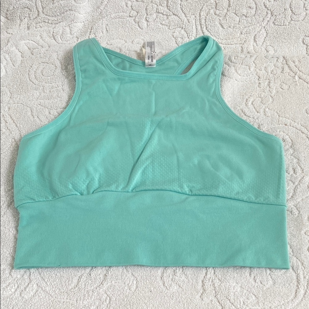 FP MOVEMENT tank 
NWOT 
Green/blue colour 
Size m/l
Opening in back​​​​​
